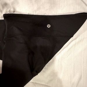 Black Lulu Legging Size four, worn once, no stains and lulu symbol in-tacked